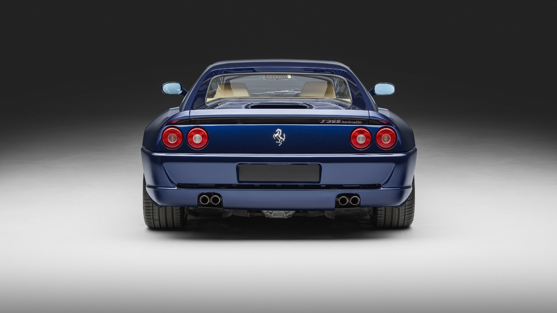 Blue Ferrari F355 Berlinetta, rear view