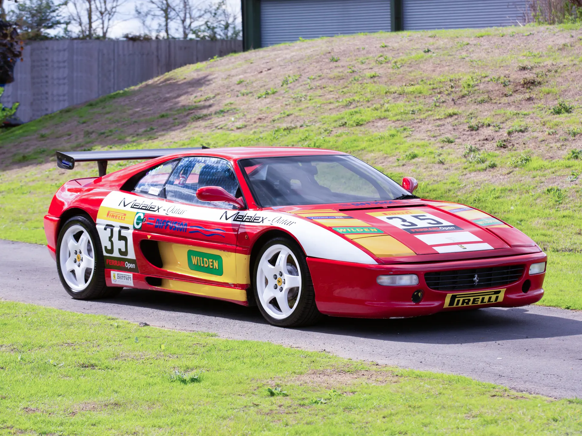 Ferrari F355 Challenge race car in red livery on track